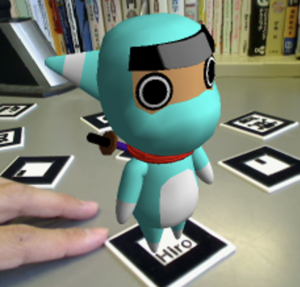 AR virtual object martian like character stands on a QR code
